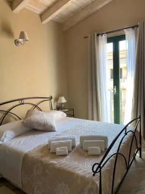 Letto o letti in una camera di La Soffitta di EmmaSofia