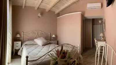 Letto o letti in una camera di La Soffitta di EmmaSofia