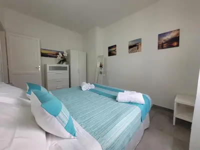 Letto o letti in una camera di Casa Antonella, a due passi dalla spiaggia, Total relax