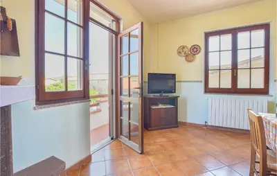TV o dispositivi per l'intrattenimento presso Nice Apartment In Villaurbana With Wifi