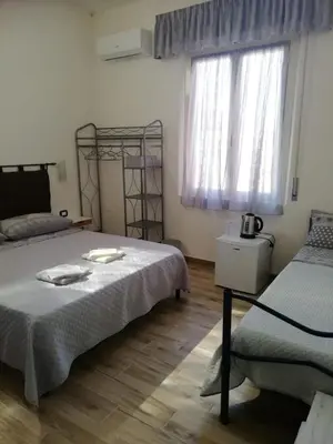 Letto o letti in una camera di B&B Casa Delfina