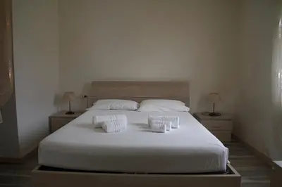 Letto o letti in una camera di Casa Aida