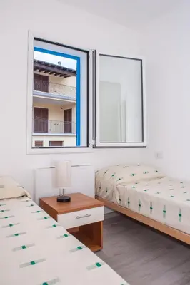 Letto o letti in una camera di White & Blue