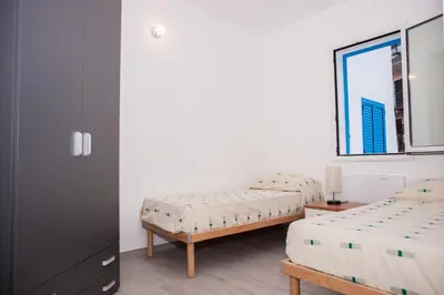 Letto o letti in una camera di White & Blue