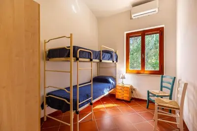 Letto o letti in una camera di VILLA ROSANNA