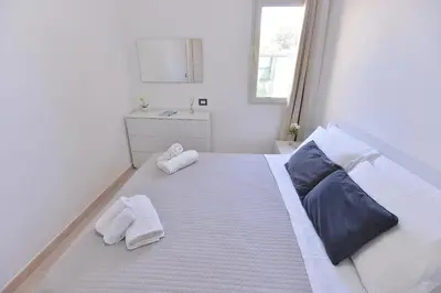 Letto o letti in una camera di IzzHome Lagoon