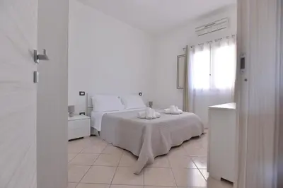 Letto o letti in una camera di IzzHome Lagoon