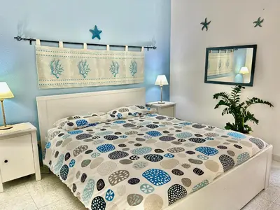 Letto o letti in una camera di Sea View Apartment
