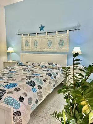 Letto o letti in una camera di Sea View Apartment