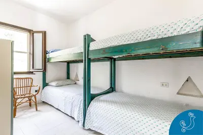 Letto o letti in una camera di Villa Valeria - Charming house close to the beach
