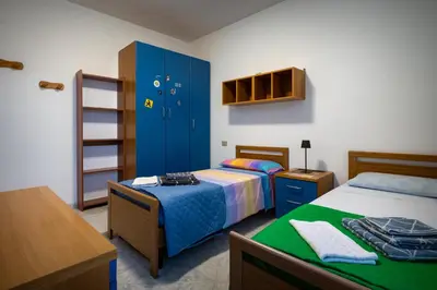 Letto o letti in una camera di Casa Marcy