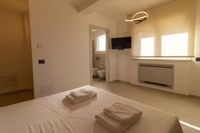 Letto o letti in una camera di Istai Poetto Apartment