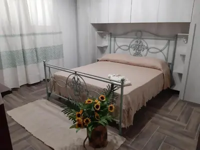 Letto o letti in una camera di Villa Erilia