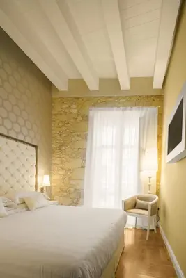 Letto o letti in una camera di Boutique Hotel Carlo Felice