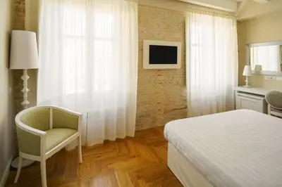 Letto o letti in una camera di Boutique Hotel Carlo Felice