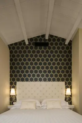 Letto o letti in una camera di Boutique Hotel Carlo Felice