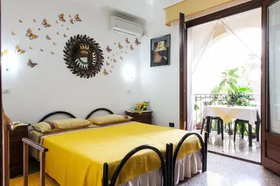 Letto o letti in una camera di Affittacamere Acquamarina