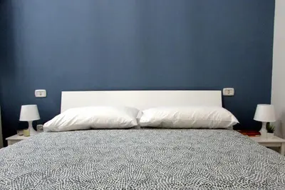 Letto o letti in una camera di Casa Almà Cagliari