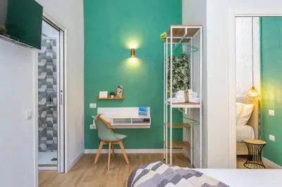 Letto o letti in una camera di Domus Laetitiae Rooms & Apartments