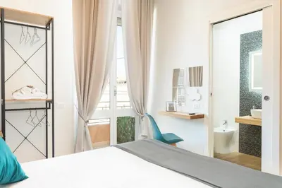 Letto o letti in una camera di Domus Laetitiae Rooms & Apartments