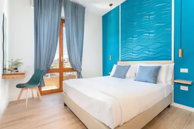 Letto o letti in una camera di Domus Laetitiae Rooms & Apartments