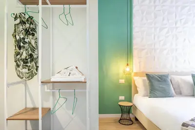 Letto o letti in una camera di Domus Laetitiae Rooms & Apartments
