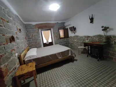 Letto o letti in una camera di Su SKUSORGIU