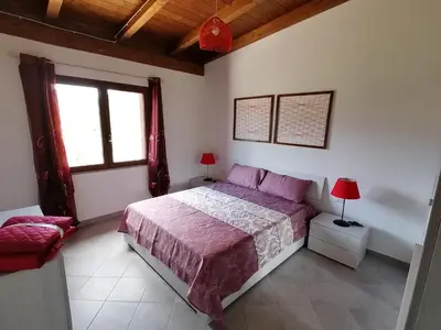 Letto o letti in una camera di AGRITURISMO VIGNA DE' LUCERI