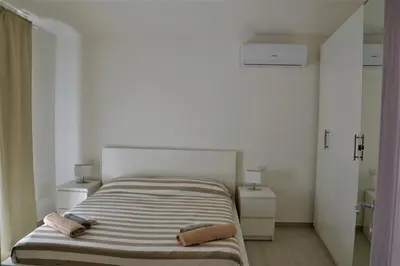 Letto o letti in una camera di - La Casa delle Meraviglie- Anima Sarda