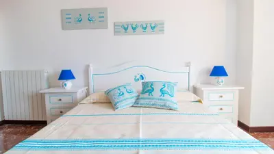 Letto o letti in una camera di Cocco e Dessi Home