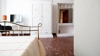 Letto o letti in una camera di Cocco e Dessi Home