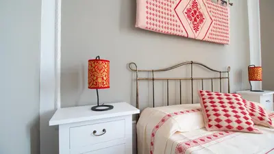 Letto o letti in una camera di Cocco e Dessi Home