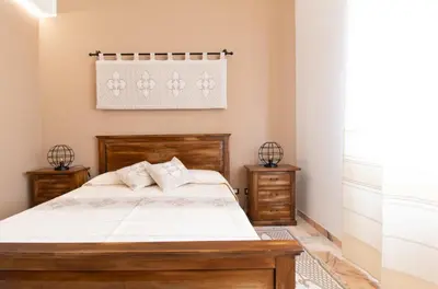 Letto o letti in una camera di Cocco e Dessi Home