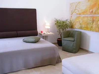 Letto o letti in una camera di Villa Ferrara Sardegna