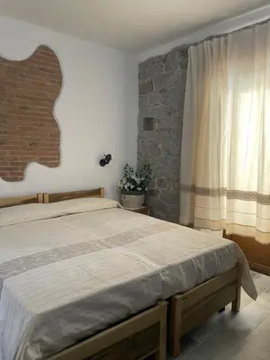 Letto o letti in una camera di Il Giglio Affittacamere
