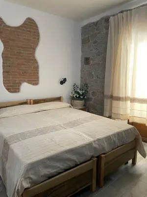 Letto o letti in una camera di Il Giglio Affittacamere