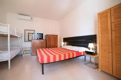Letto o letti in una camera di Monolocale Free Beach Residence due passi dal mare