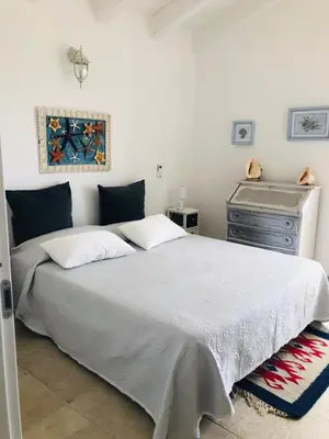 Letto o letti in una camera di Luxury& Charme vista mare Sardinia House