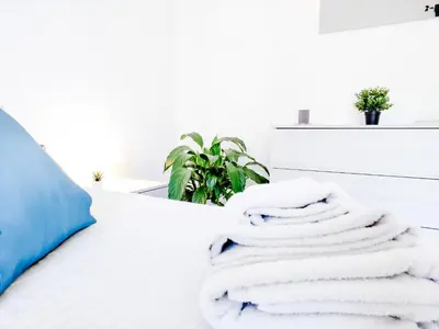 Letto o letti in una camera di Appartamento La Capretta Bianca - Affitti Brevi Italia