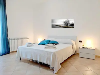 Letto o letti in una camera di Appartamento La Capretta Bianca - Affitti Brevi Italia