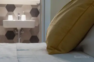 Letto o letti in una camera di NEW HOME - appartamento in centro storico