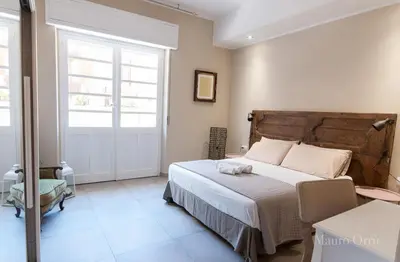 Letto o letti in una camera di NEW HOME - appartamento in centro storico