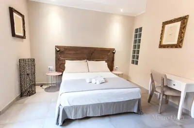 Letto o letti in una camera di NEW HOME - appartamento in centro storico