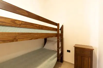 Letto o letti in una camera di Casa Amelia sul Mare