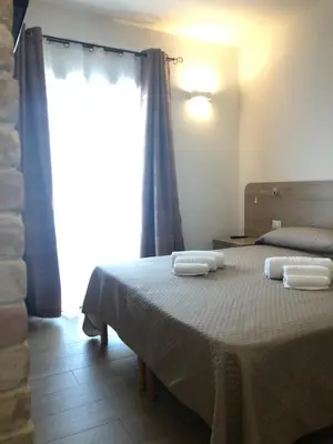 Letto o letti in una camera di Affittacamere Su Caboni