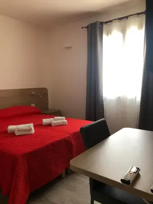 Letto o letti in una camera di Affittacamere Su Caboni