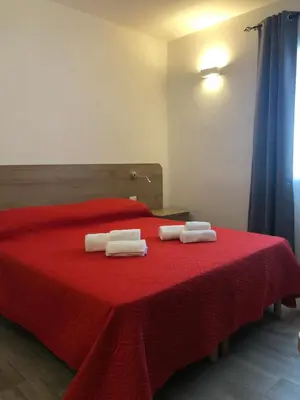 Letto o letti in una camera di Affittacamere Su Caboni