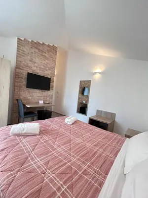 Letto o letti in una camera di Affittacamere Su Caboni