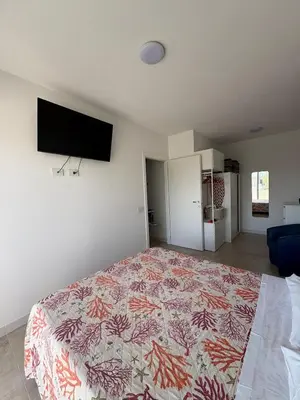 TV o dispositivi per l'intrattenimento presso Torregrande Apartments