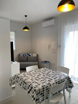 Area soggiorno di Torregrande Apartments